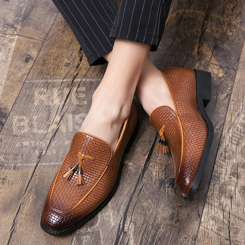 Men's black pointed toe slip-on loafers with a tassel detail on the artificial PU upper.