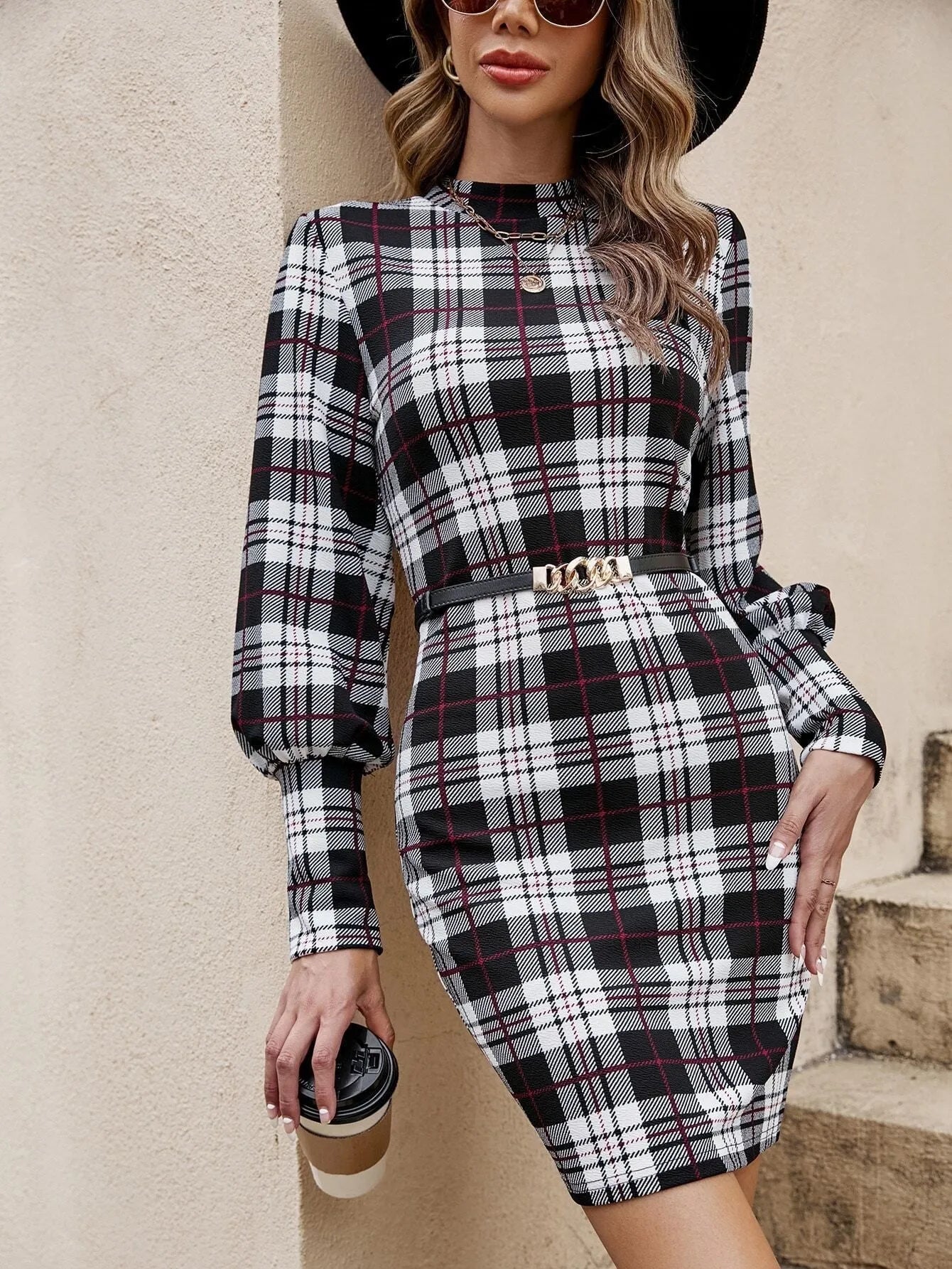 Black women's dress with lantern sleeves and leather stitching details, mid-length tight skirt silhouette