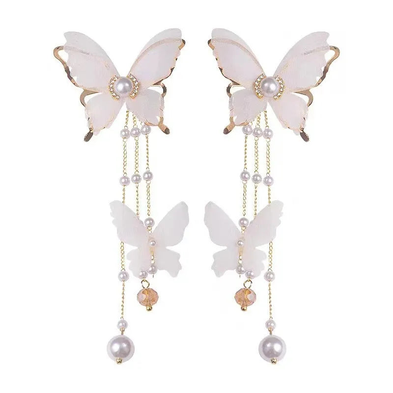 Butterfly-shaped earrings with rhinestones, pearls, and tassel lace on copper alloy with white electroplated finish