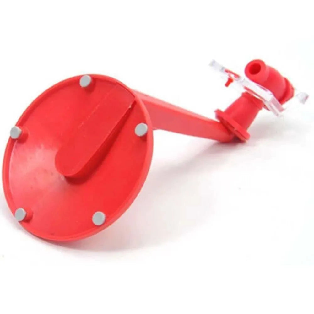 Red plastic Magic Tap soda drink dispenser for 2-litre bottles on a kitchen counter.