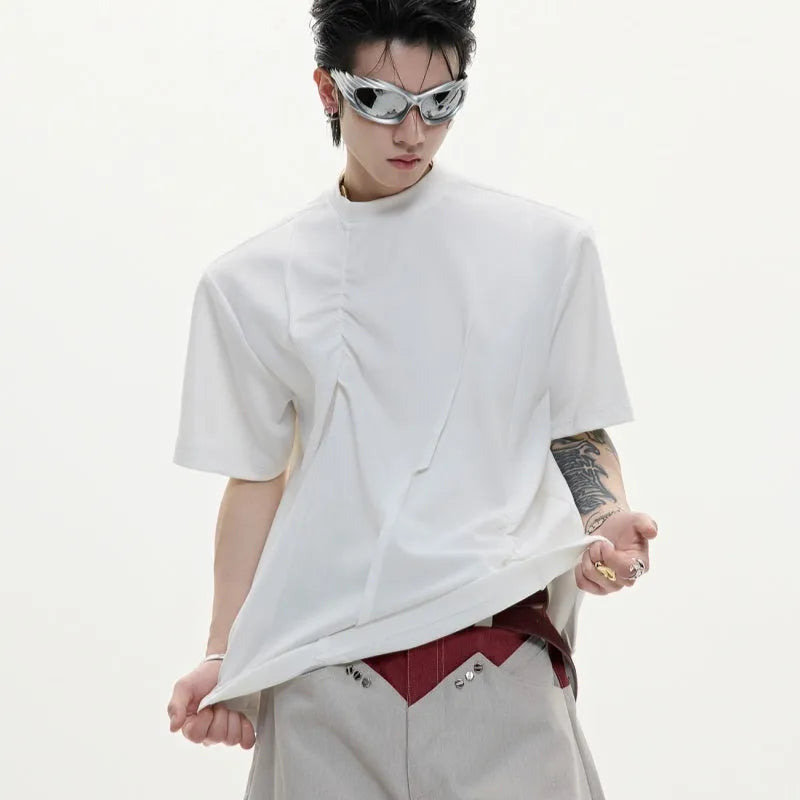 Men's grey loose-fit cotton t-shirt with three-dimensional pleats and a round neck.