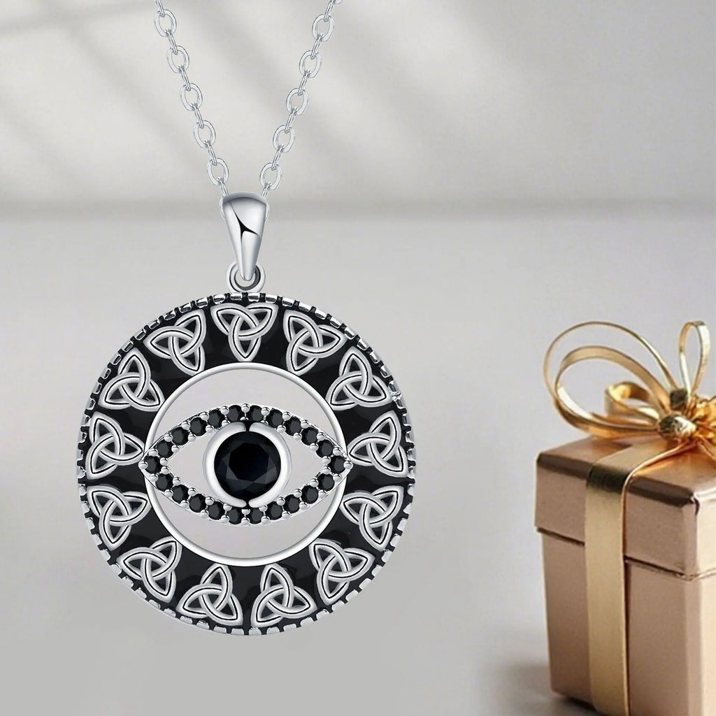 Copper Devil's Eye necklace with cross chain style pendant and electroplated finish.