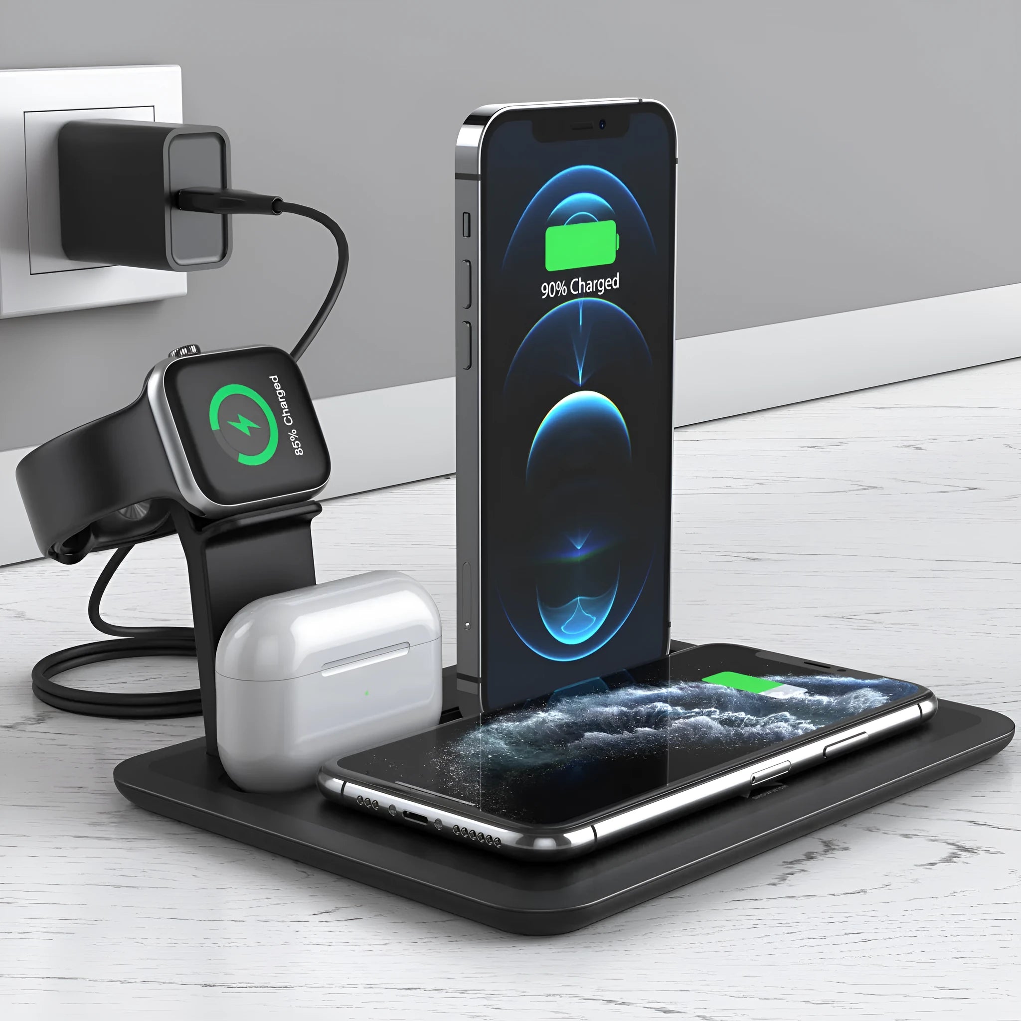 Black and white wireless charging station for mobile phone, smartwatch, and headphones on a desk.