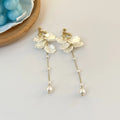 Women's acrylic shell pearl tassel earrings showing 8.8cm length and tassel design