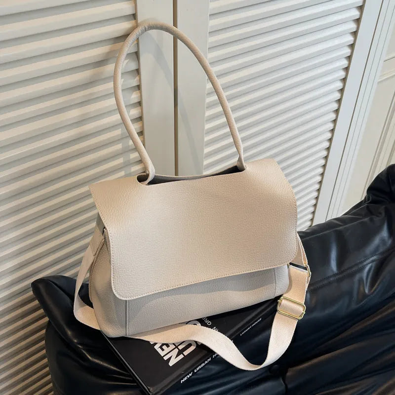 Vintage casual PU tote bag in horizontal square shape with double straps and sewn thread detailing.