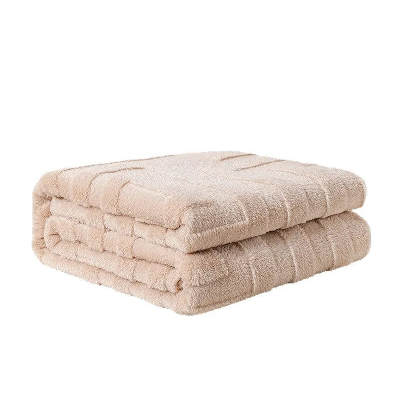 Thick square coral fleece flannel blanket with solid colour and floral pattern, folded to show texture.