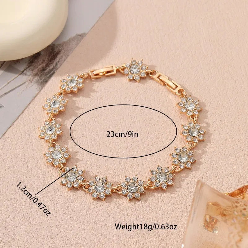 Electroplated zinc alloy flower bracelet with coloured gems in gold and silver colour options