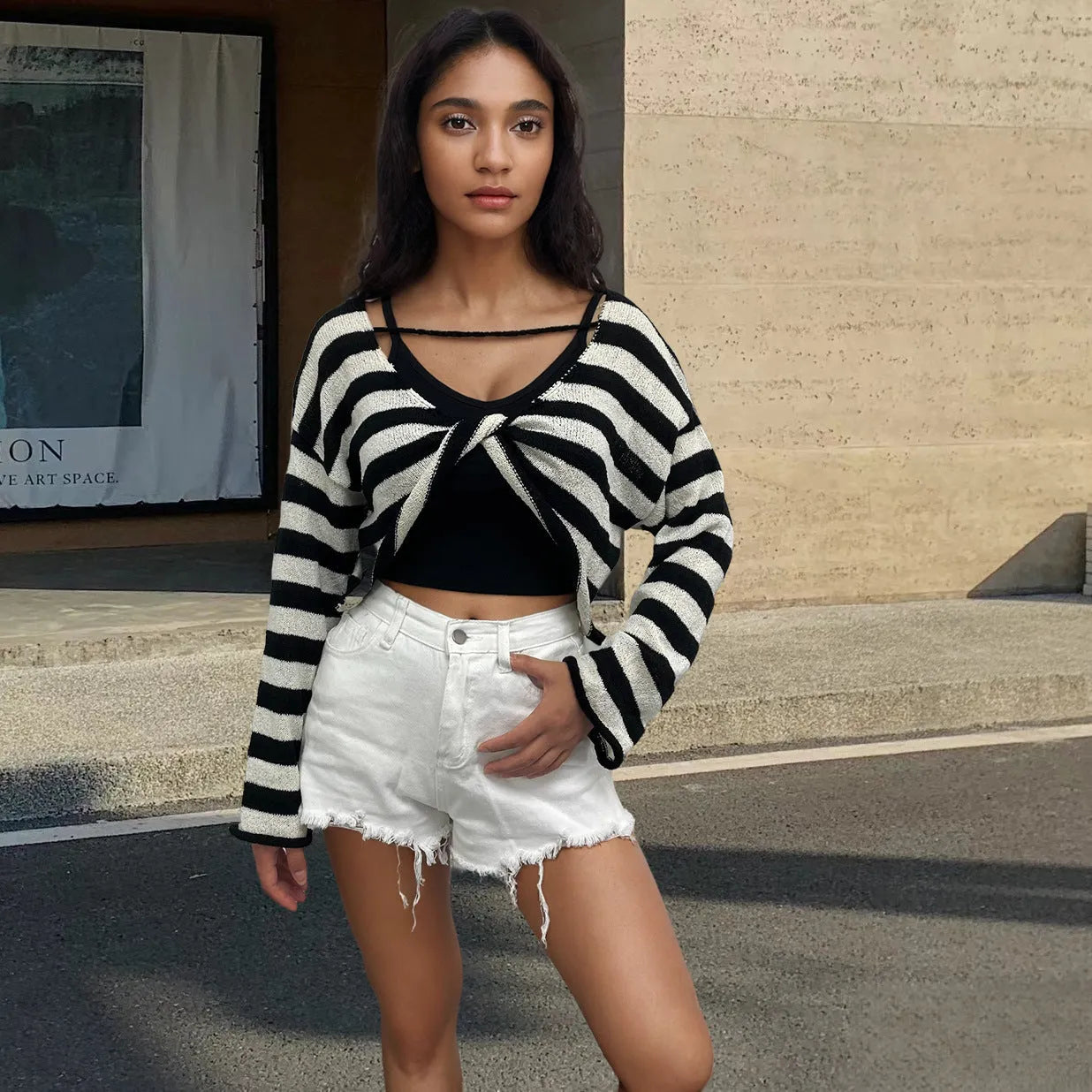 Long-sleeved striped pullover sweater in mercerised cotton shown in multiple colours.