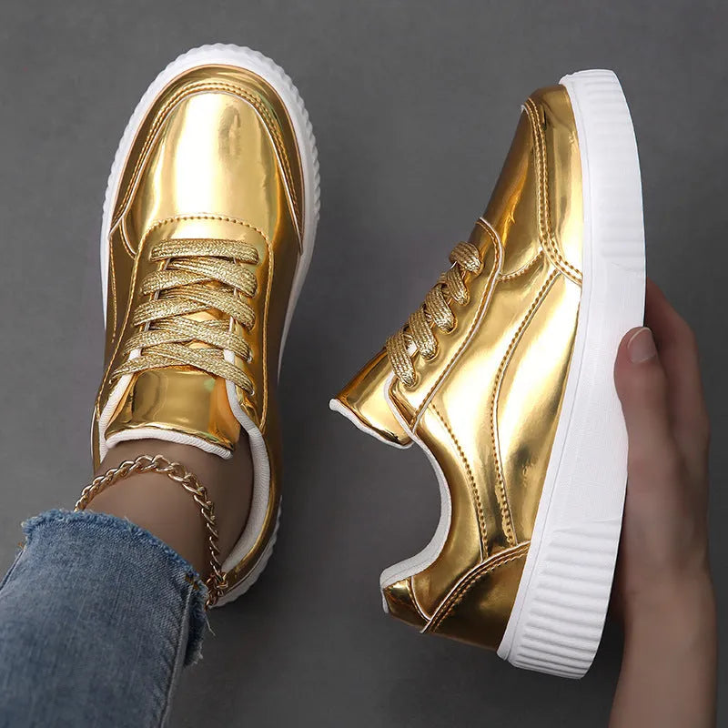 Rose gold sequinned platform sneakers with round toe and thick MD sole on a white background