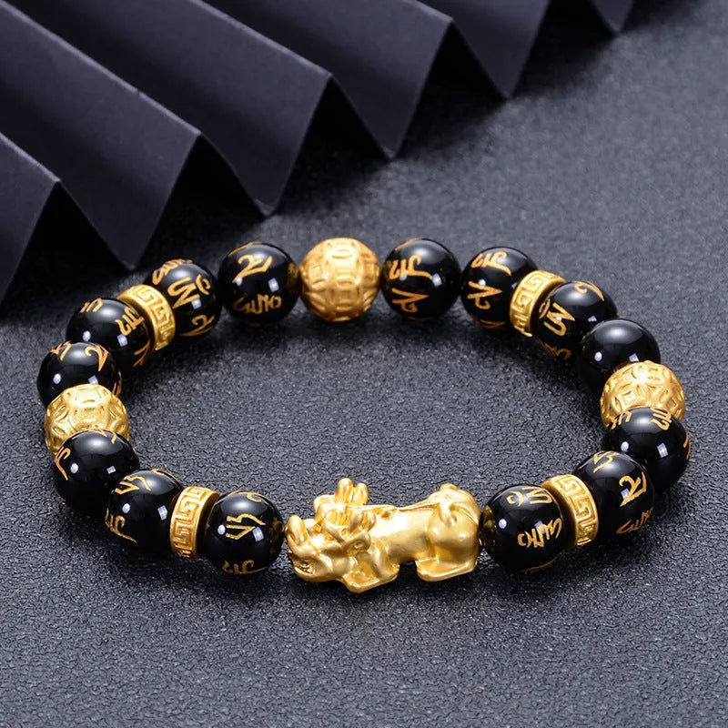 Unisex natural black agate stone bracelet with imitation gold accent, round bead design