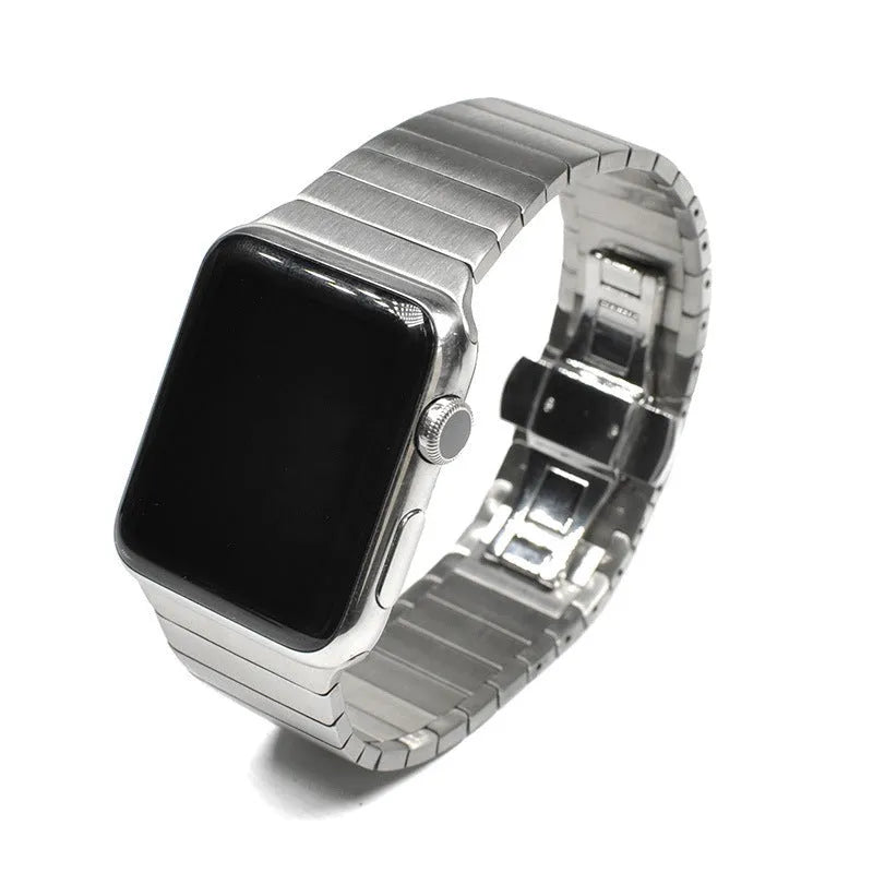 Silver metal Apple Watch strap with butterfly buckle on a 42mm watch case.