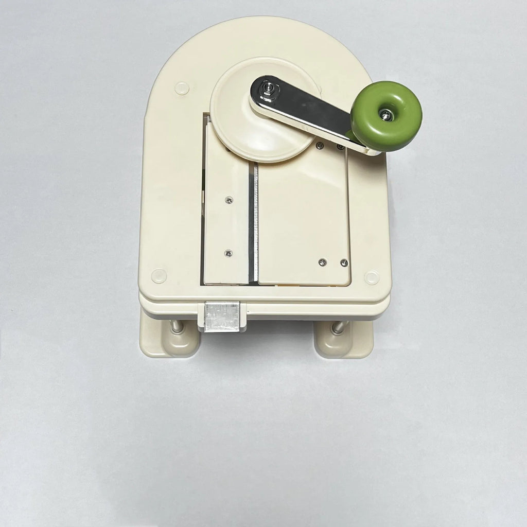 Beige stainless steel vegetable slicer chopper and spiralizer tool for kitchen use