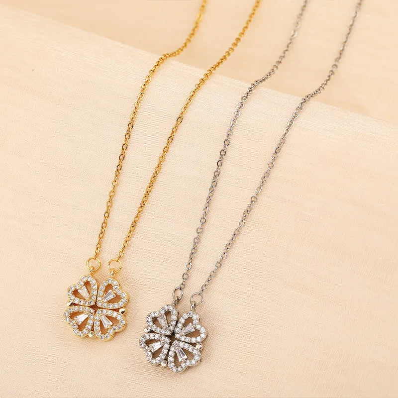 Four-leaf clover titanium steel necklace with diamond inlay pendant, gold finish, 42+6cm chain on light background