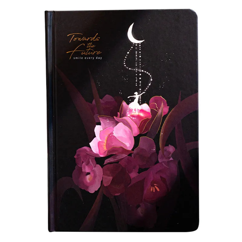 A5 size notebook with a luminous cover, open to show colour illustration pages and lined 160gsm paper.