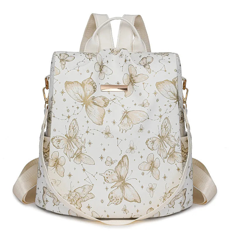 Butterfly print backpack with sewing line detail shown in multiple colour options