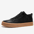Men's black leather casual shoes with round toe and lanyard closure on white background