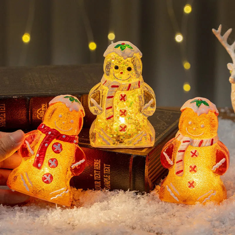 Glowing Christmas gingerbread man snowman ornament in plastic with four colour variations including clear, white and red scarf options
