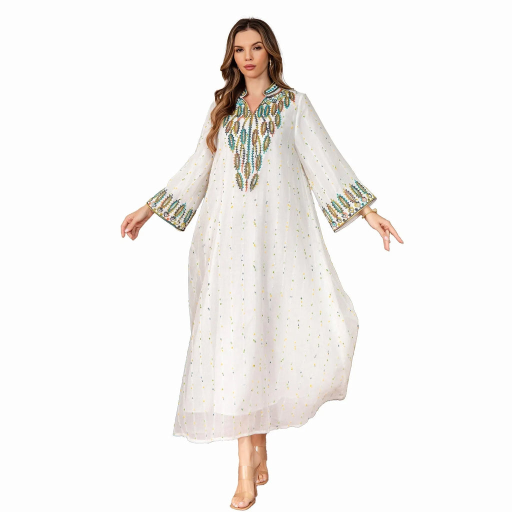 White polyester Arabic robe for women with long sleeves and long skirt.