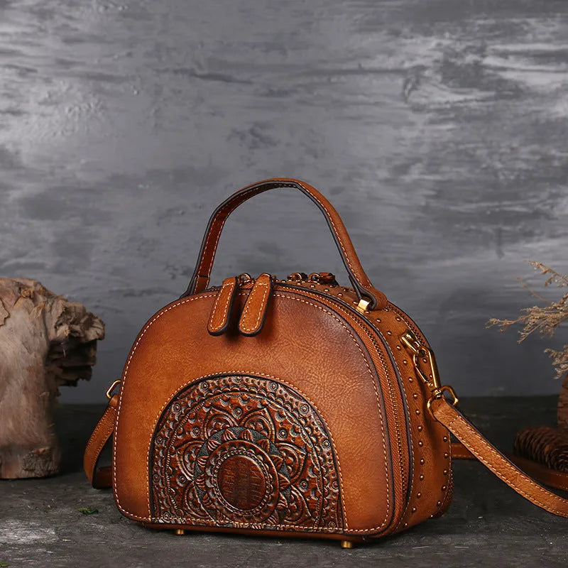 Vintage leather handbag showing internal organisation pockets including mobile phone compartment and ID bag