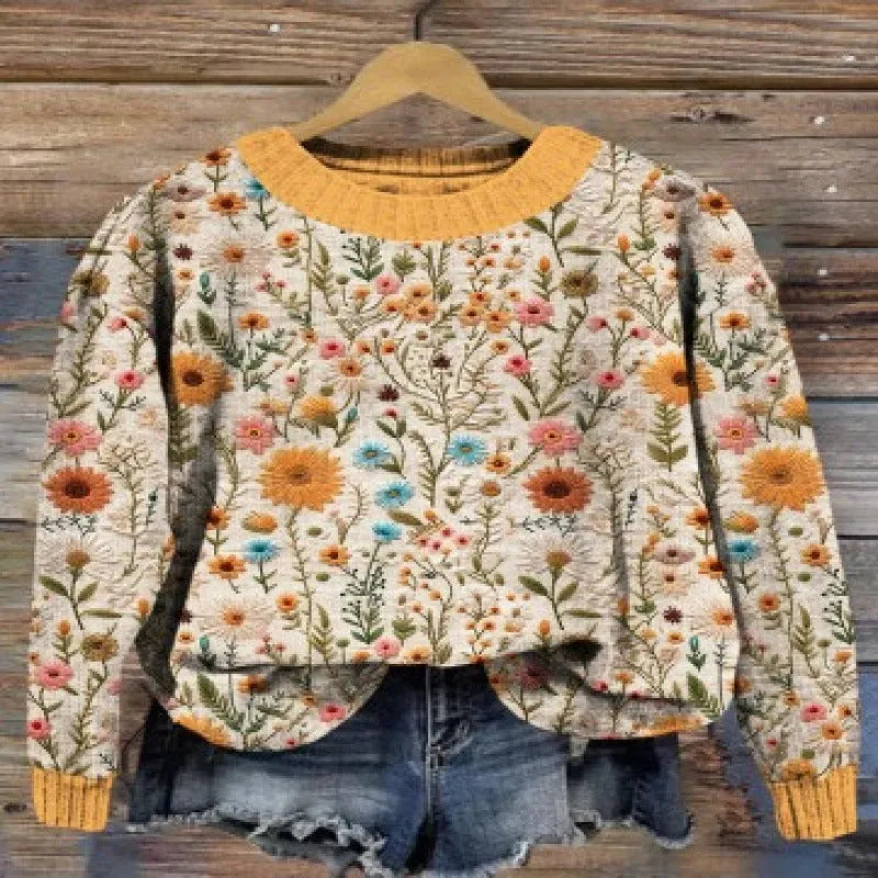 Women's round neck sweater with a small floral digital print pattern.