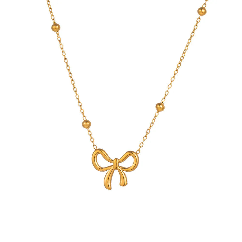 Gold electroplated bow necklace on cross chain with adjustable 41-50cm length