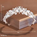 A gold-coloured alloy crown headdress for women with glass pearl decorations on a model's hair.