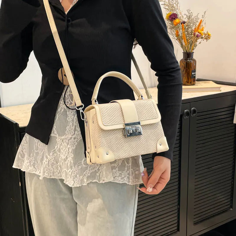 PU crossbody bag in horizontal square shape with sandwich outer pocket and seven colour options including black and orange