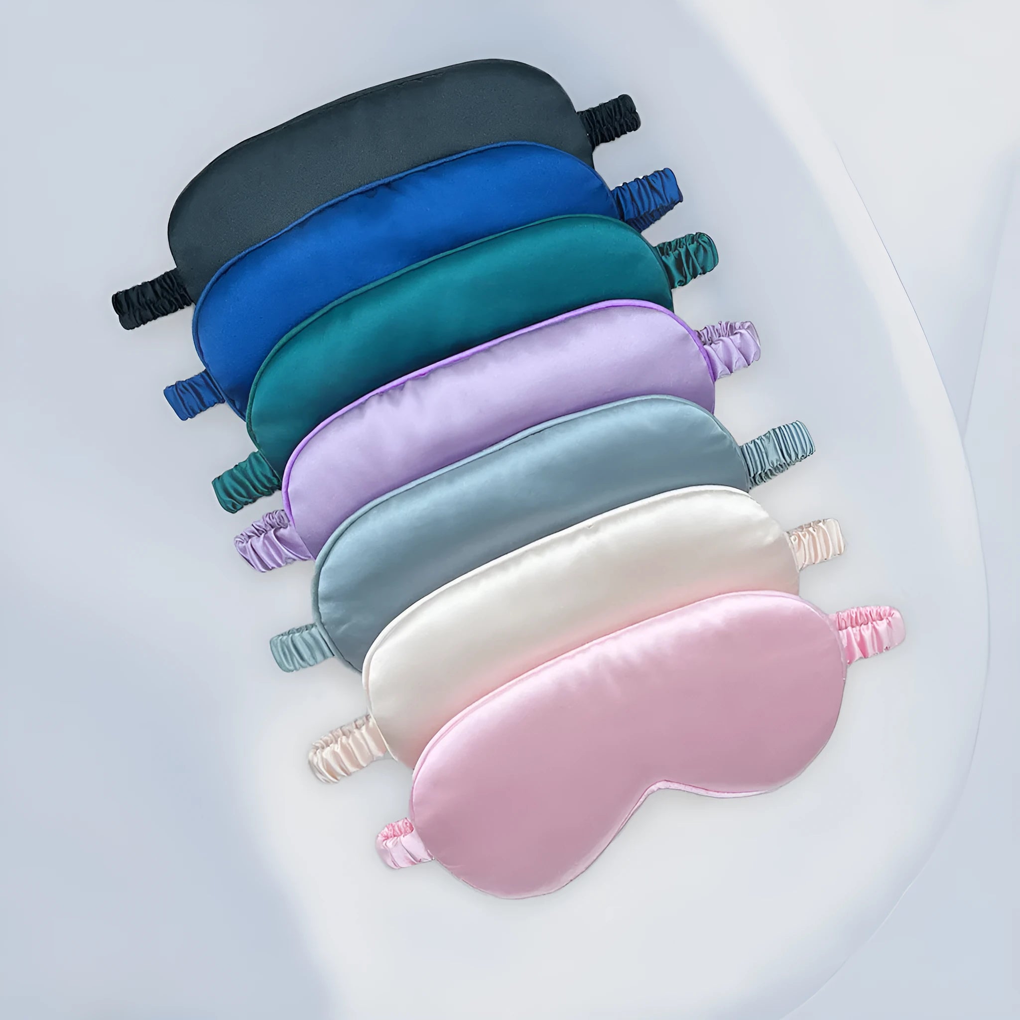 Double-sided rayon satin sleep eyeshade in multiple colour options on a white background.