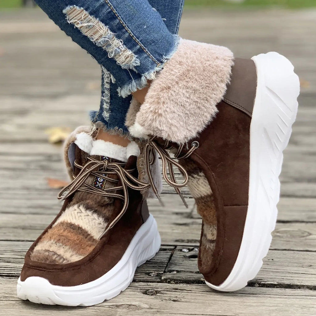 Women's beige lace-up snow boots with suede upper and thermal plush lining on a rubber sole.