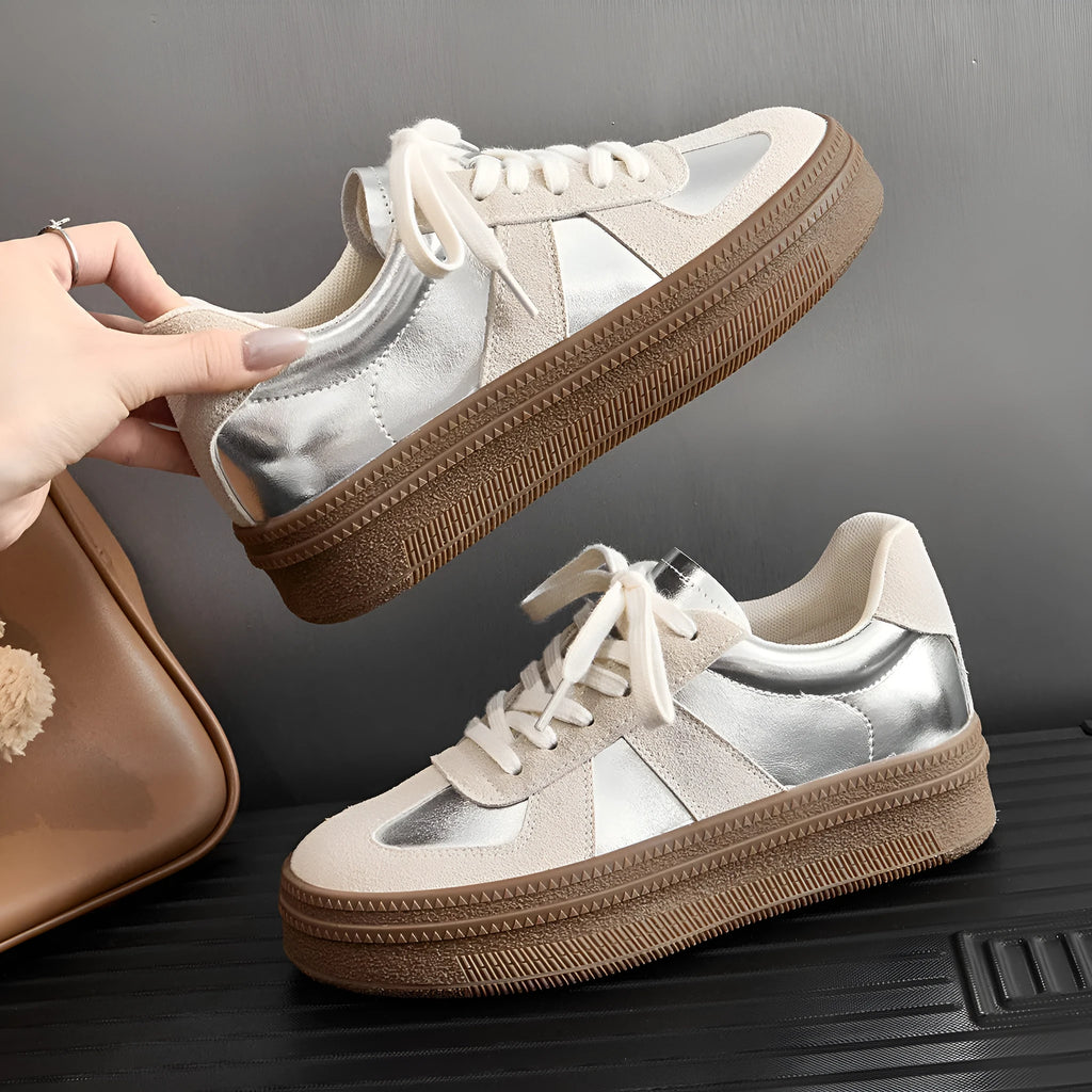 Retro-style beige casual board shoes with cross straps and round toe on a rubber sole.