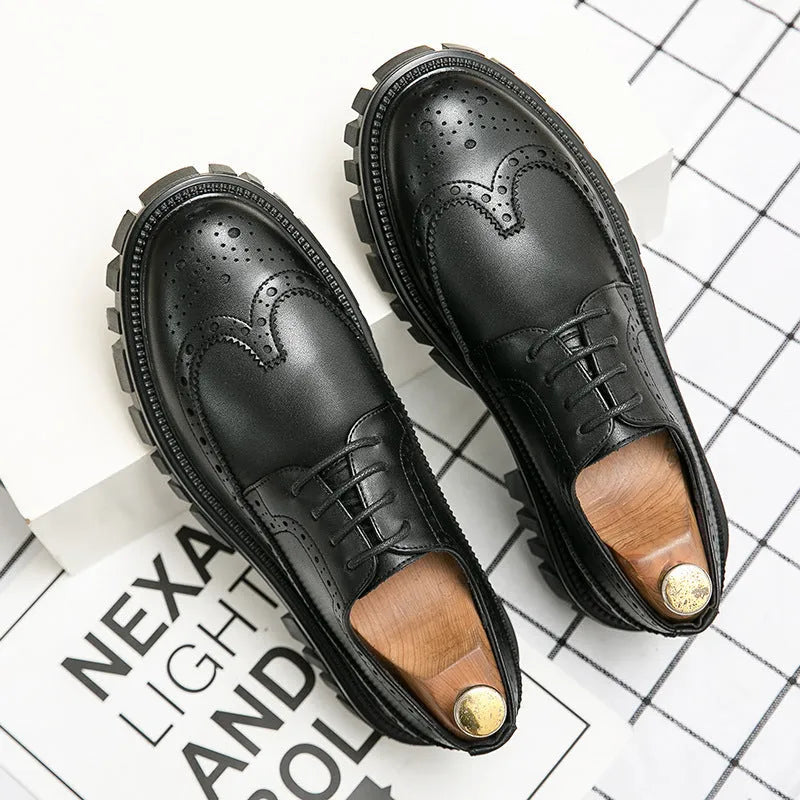 Men's black brogue leather shoes with round toe on a solid background
