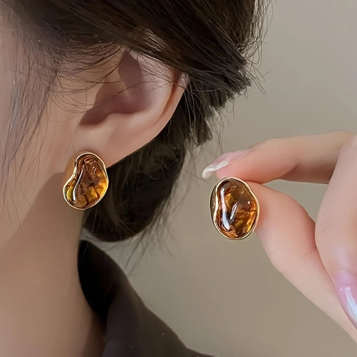Handmade geometric holiday ear ring set showing three styles with tassel elements in different designs