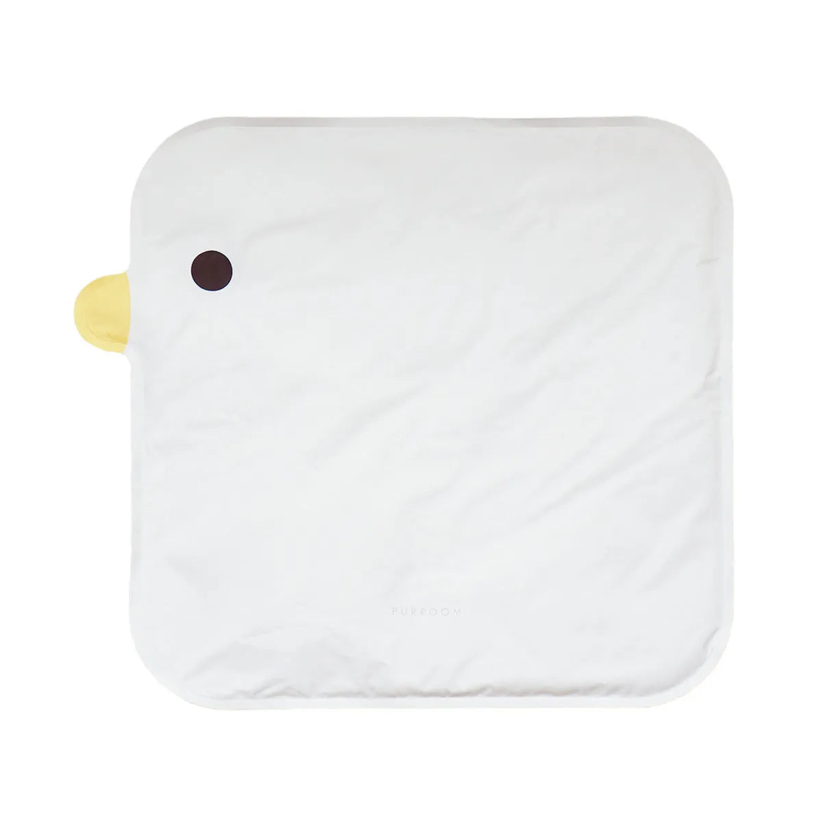 Yellow chick-shaped pet cooling mat on a wooden floor, showing non-stick fabric surface.
