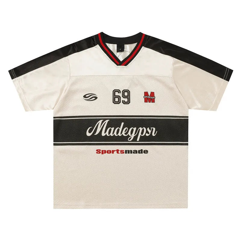 Apricot V-neck sports jersey top with lettered pattern and drop-shoulder sleeves laid flat