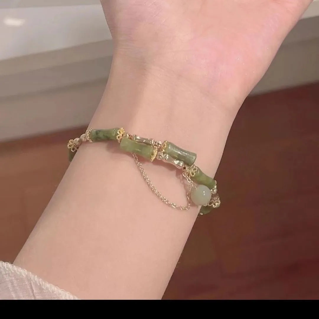 Women's handmade bamboo bracelet with plum wine colour and baking varnish finish