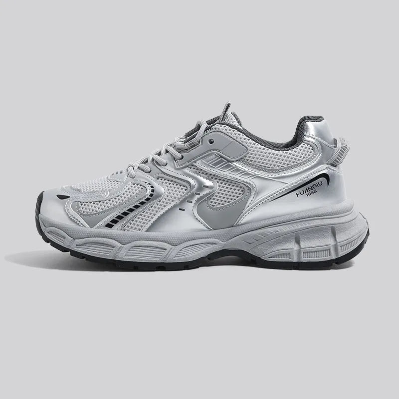 Grey low-top casual sneaker with PU mesh upper, round toe, lace-up front, and a flat EVA sole on a neutral background.