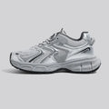 Grey low-top casual sneaker with PU mesh upper, round toe, lace-up front, and a flat EVA sole on a neutral background.