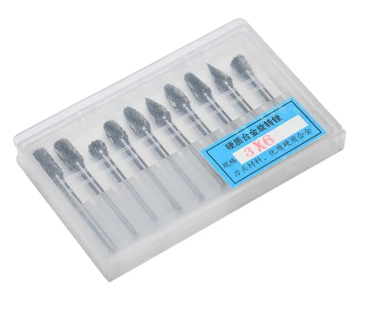 Ten tungsten steel carbide rotary burrs with 6mm head and 3mm shank arranged on a white background