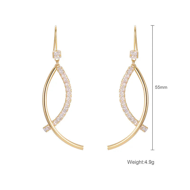 Pair of gold irregular geometric copper earrings on display