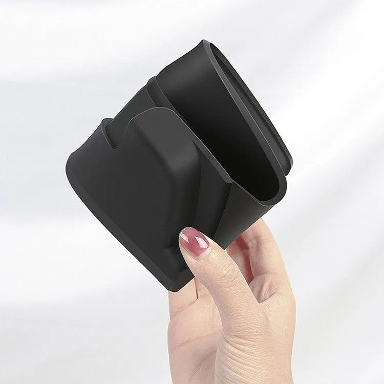Black silicone glasses case mounted in Tesla Model 3 or Y armrest compartment for organised storage