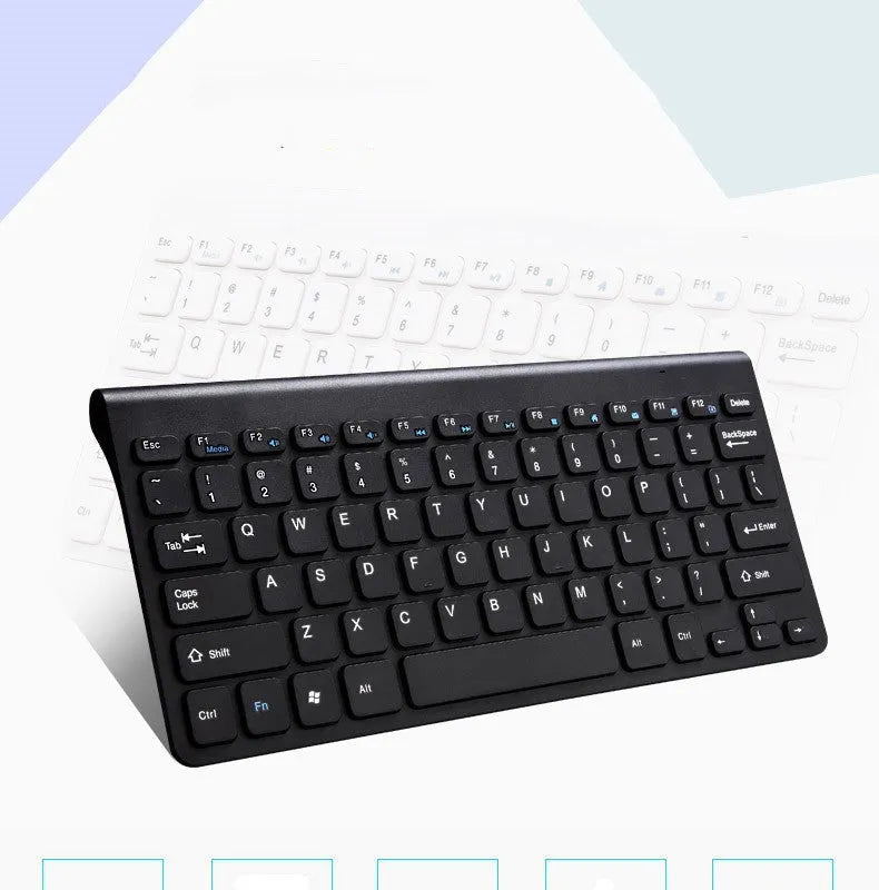 Black and white 2.4 GHz wireless keyboard and mouse set with USB receiver on a desk.