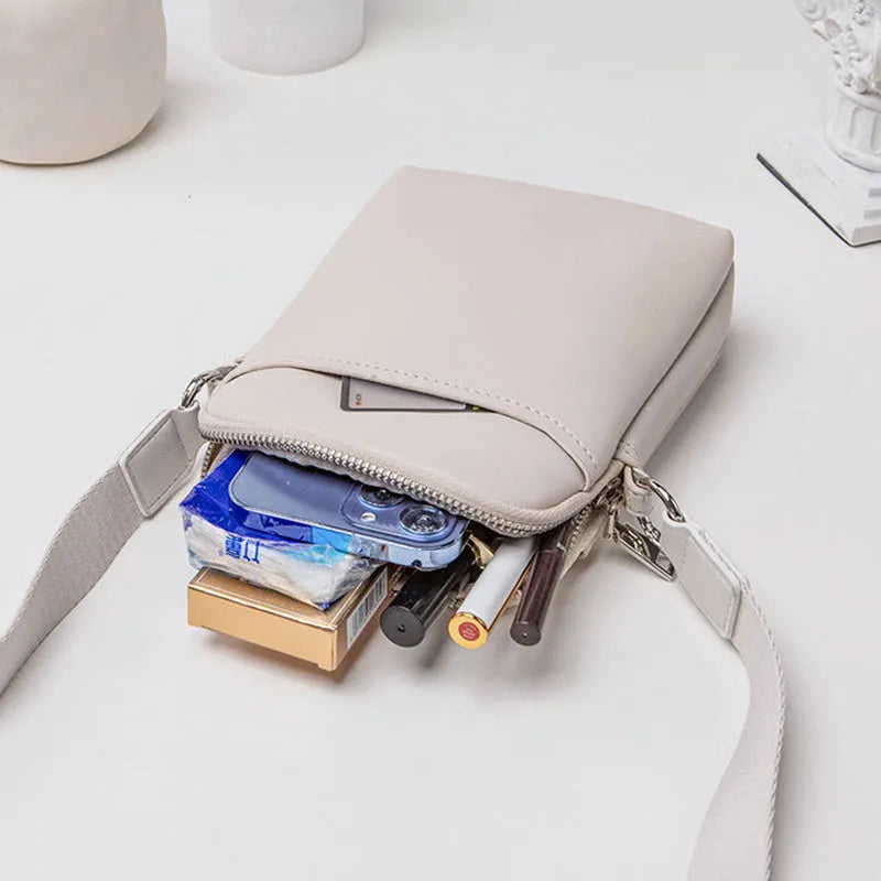 Small solid colour crossbody shoulder bag for women in PU material, shown in beige colour