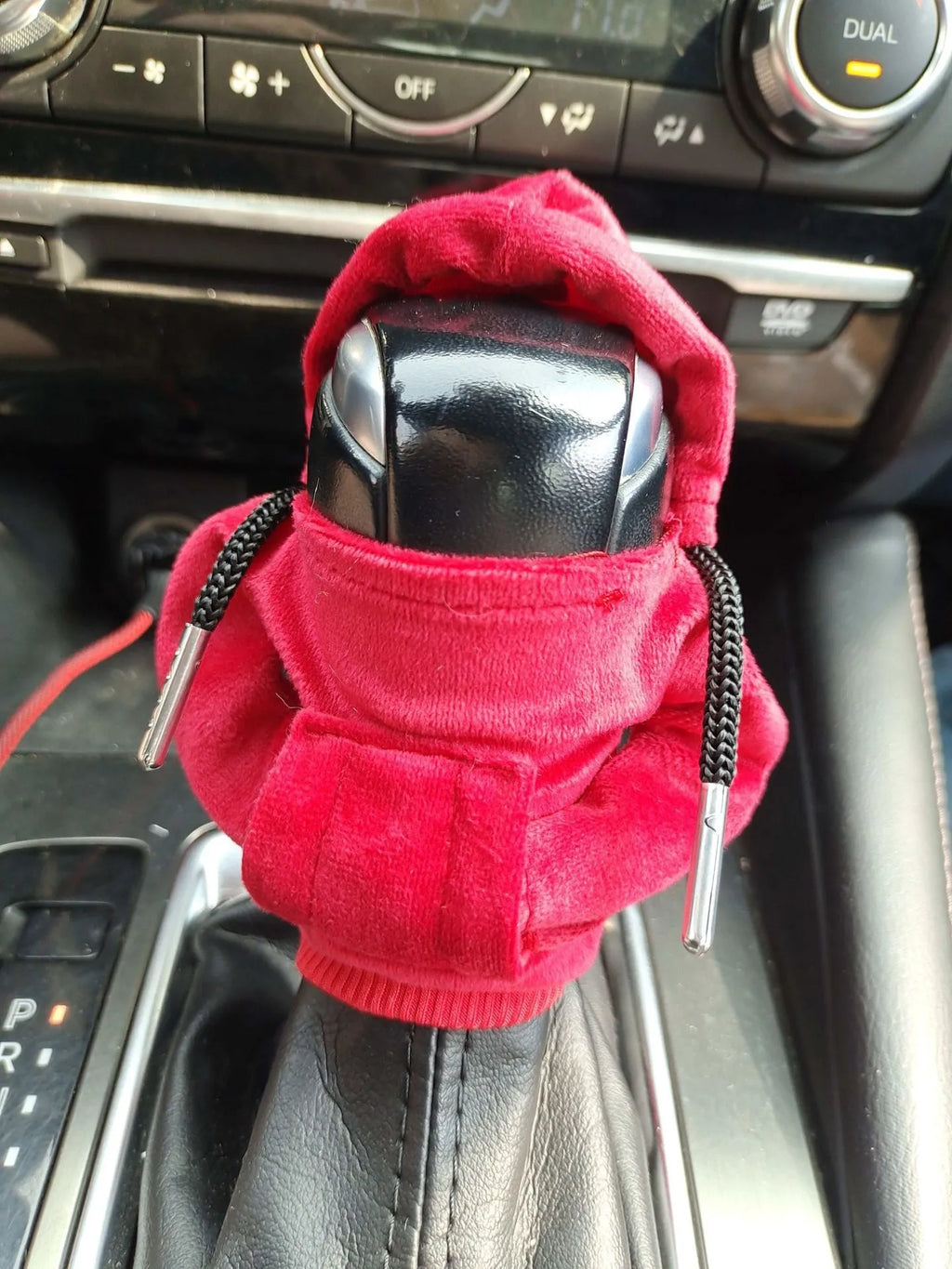 Pure cotton knitted gear lever sweater decoration in various colours on a car gear stick.
