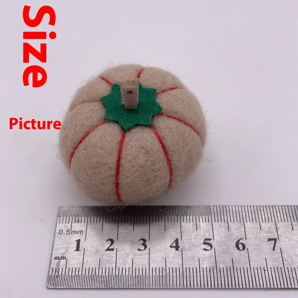 Wool felt pumpkin ornaments in autumn colours for doll decoration and crafts