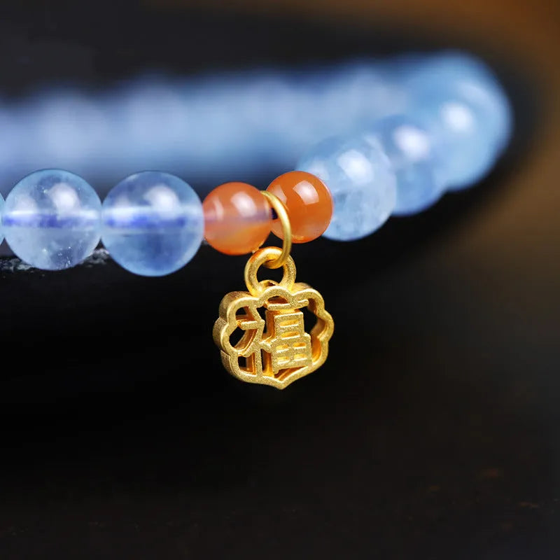 Ice translucent aquamarine bracelet with 8mm round beads and silver sequin accents