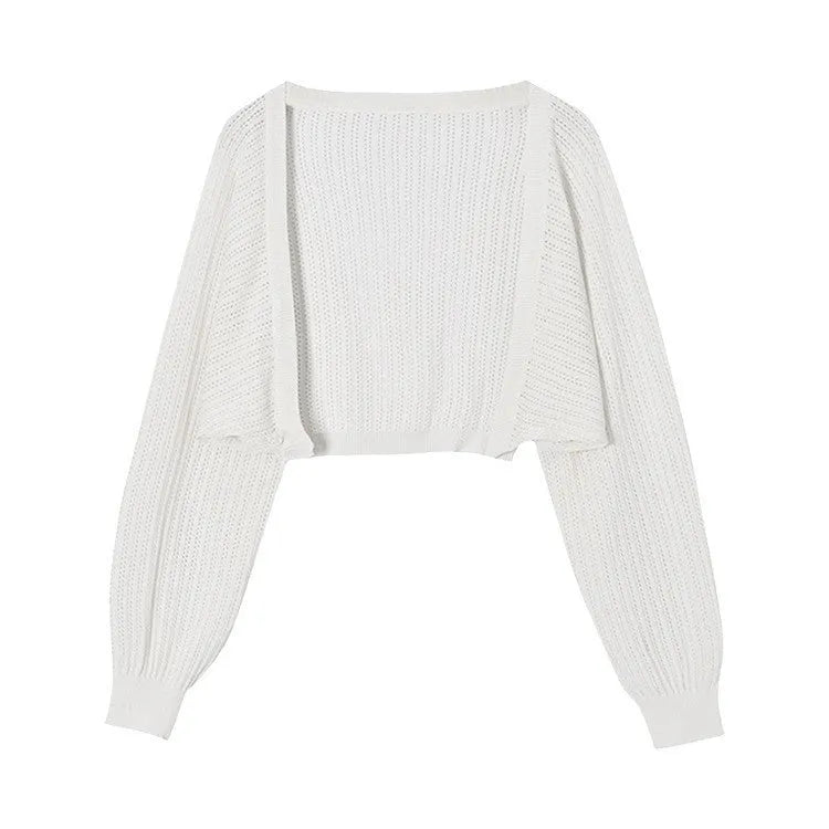 Women's apricot coloured blouse with long loose lantern sleeves and a hollow linen-look weave.