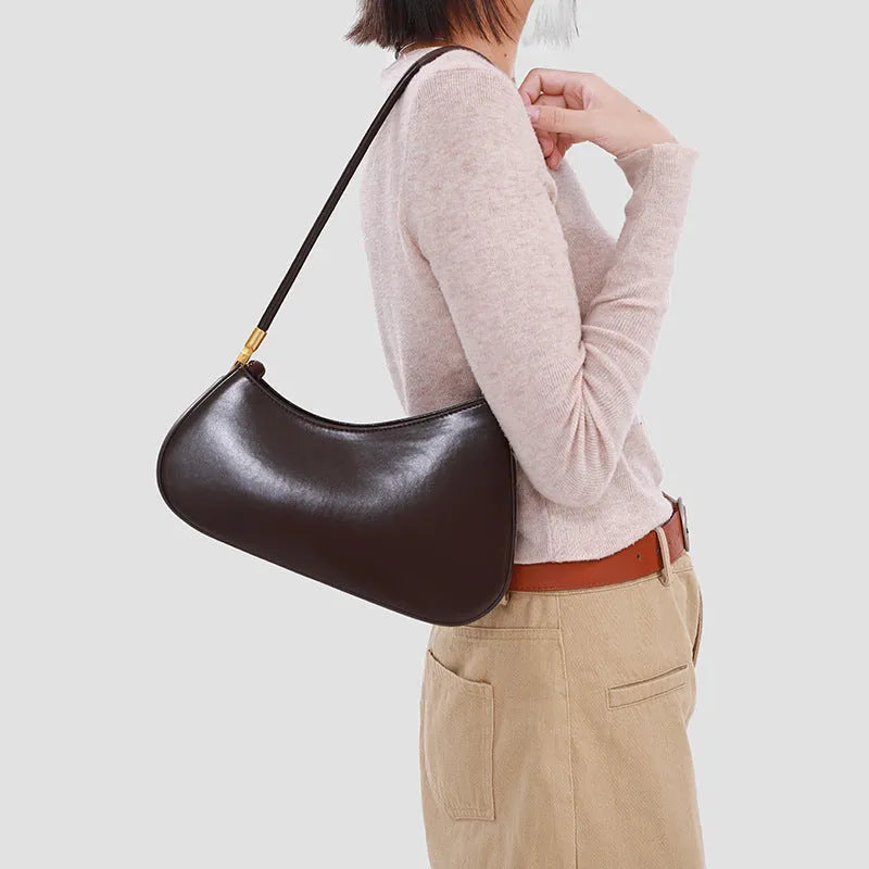 Retro oval women's underarm bag in PU leather with single shoulder strap and internal zipper compartment
