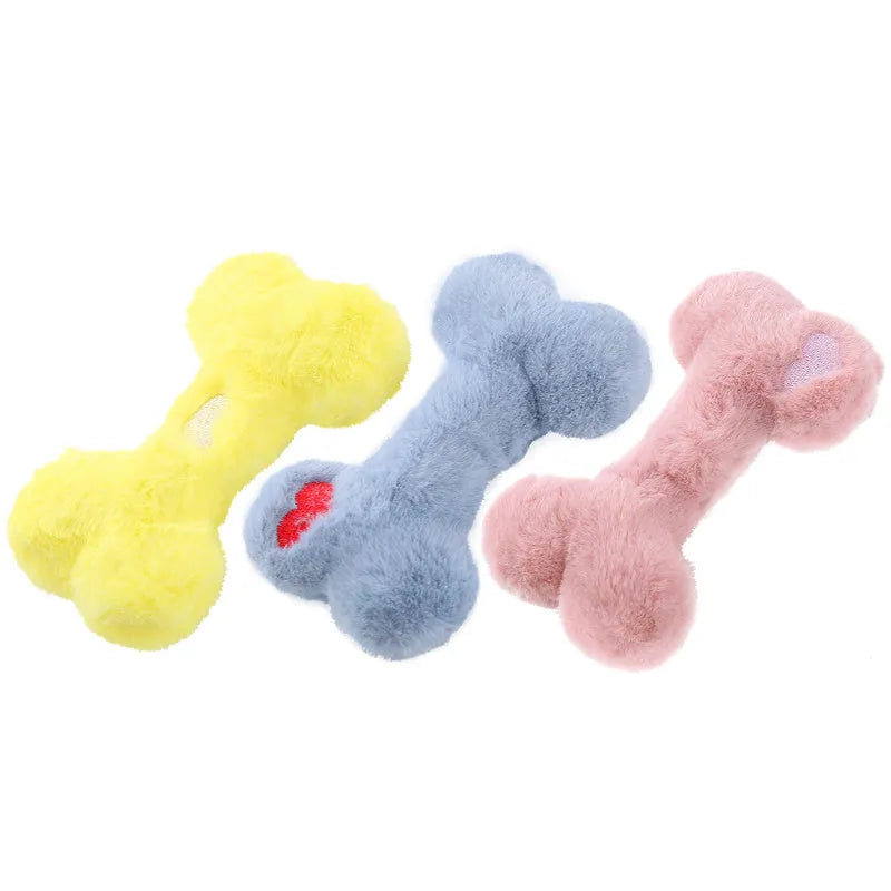 Blue Love Bone shaped plush dog toy with squeaker on a plain background.