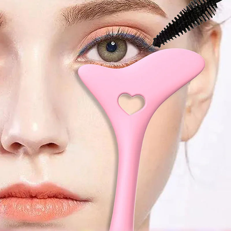 Four reusable silicone winged eyeliner stencils in pink, blue, purple, and yellow on a white background