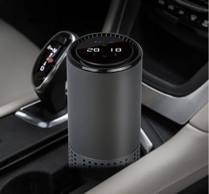 Aluminium alloy car air purifier with digital display showing air quality, temperature, and humidity readings.
